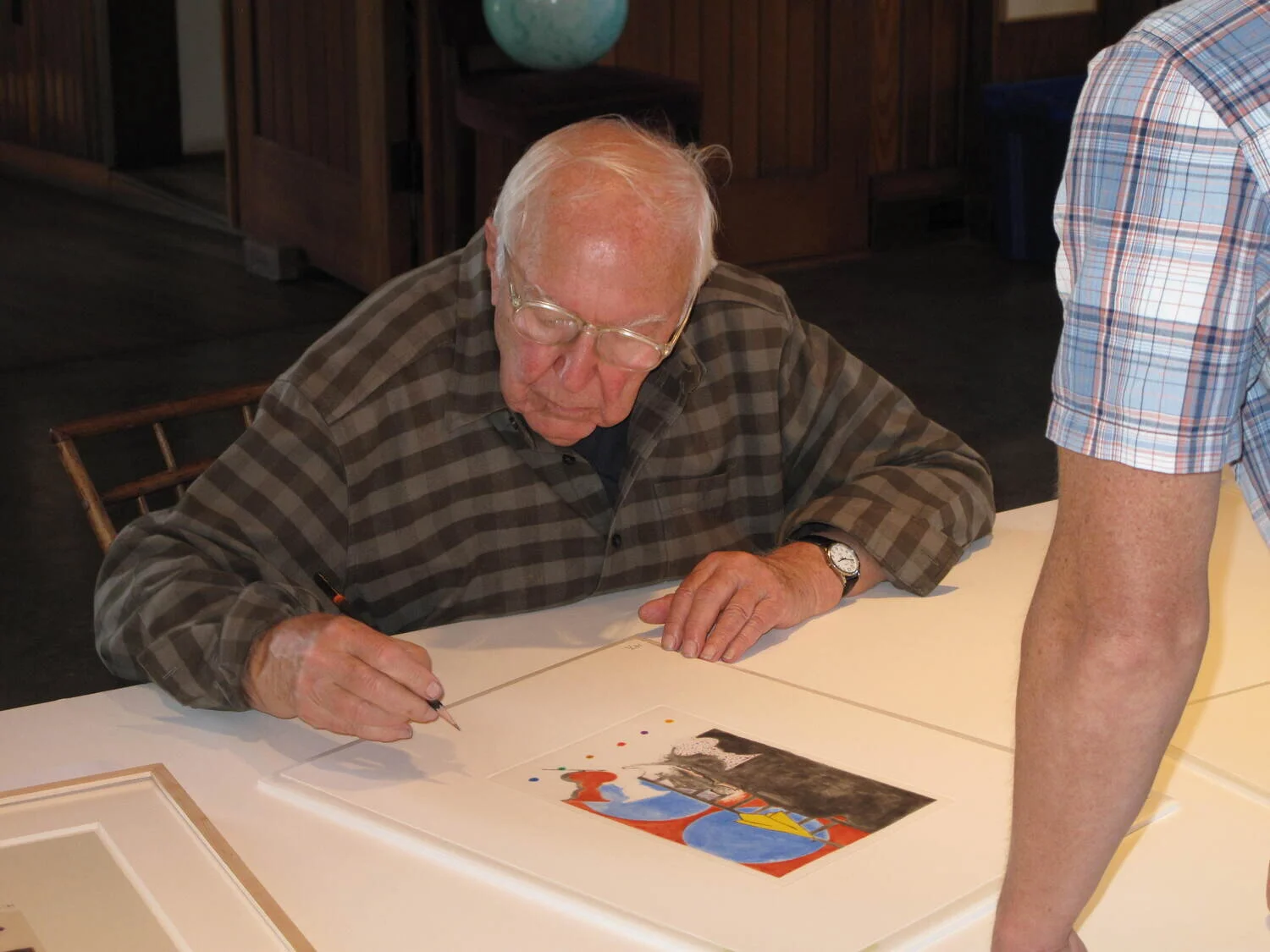 Jasper Johns signing the edition in Sharon, CT