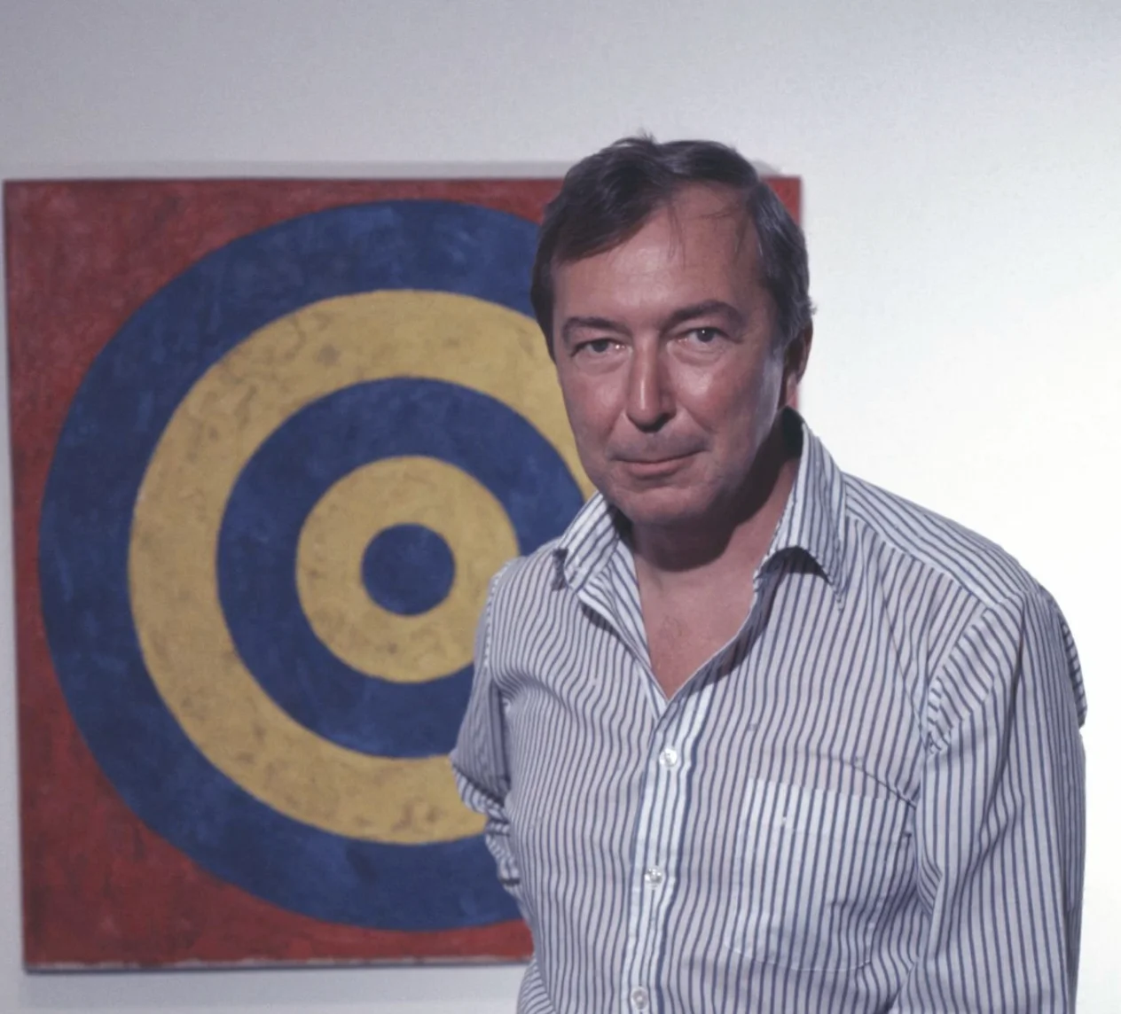 Jasper Johns photographed at an exhibition of his work at the Whitney Museum of American Art in 1977. photo by Jack Mitchell